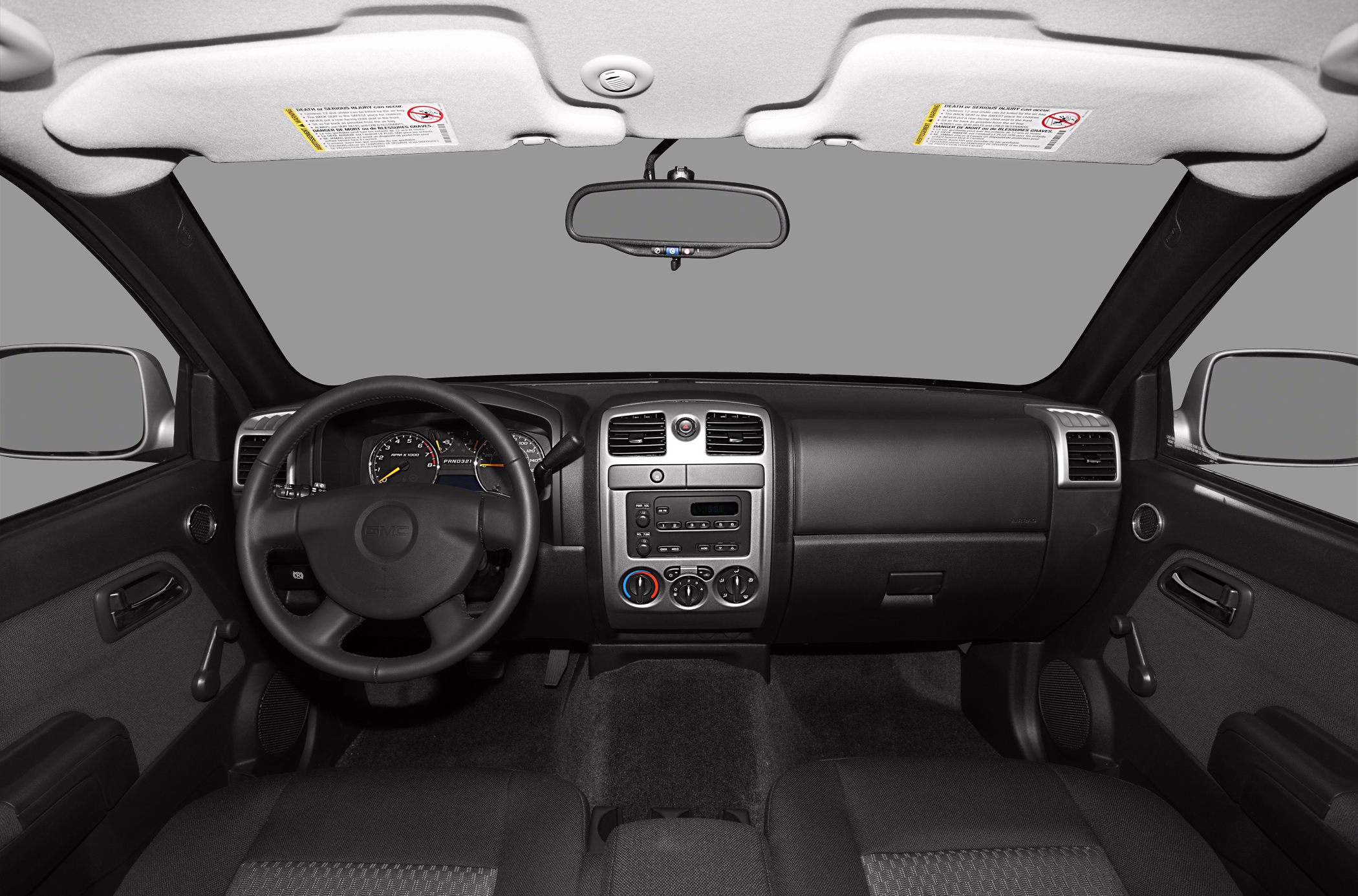 Dashboard and steering wheel with instrument cluster and controls