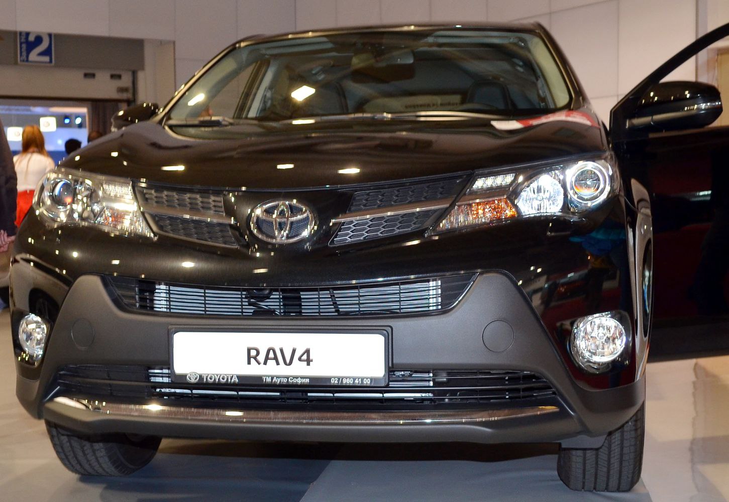 Front view with headlights, grille, and fog lights