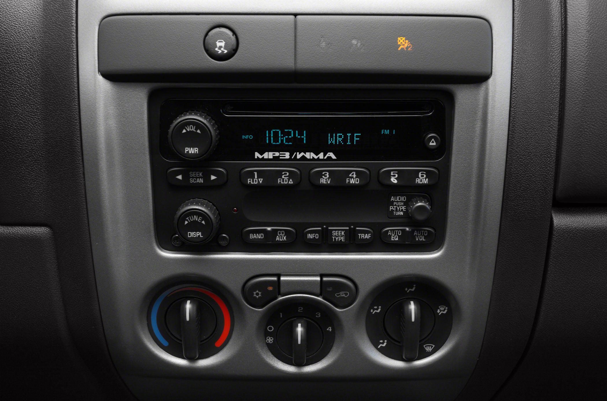 Center dashboard with audio system and climate control knobs