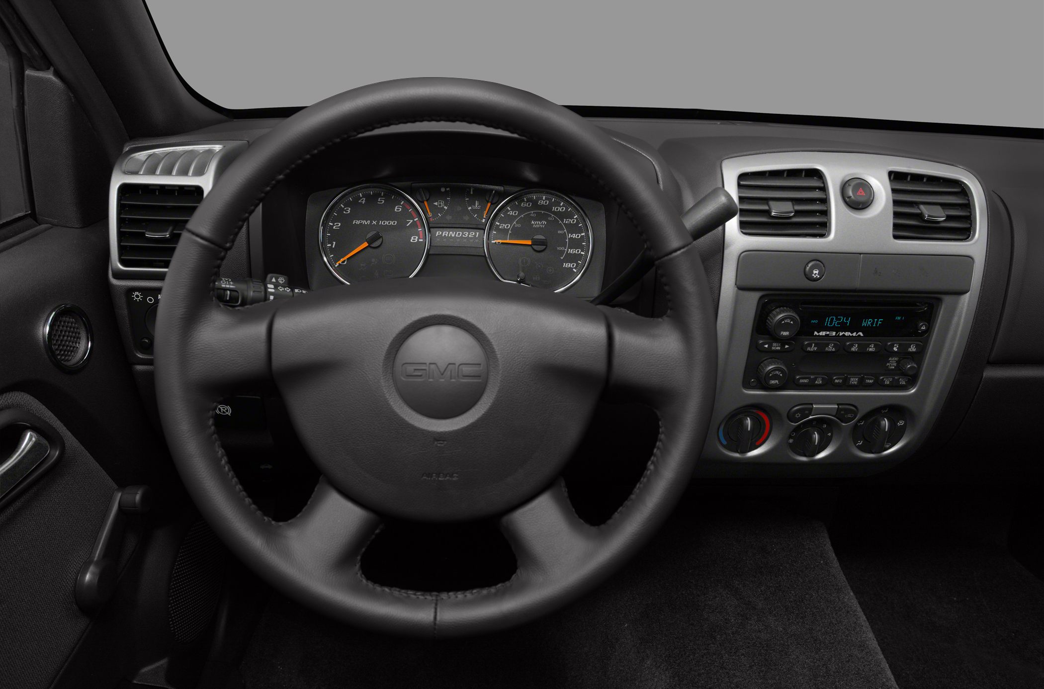 Dashboard and steering wheel with instrument cluster and console controls
