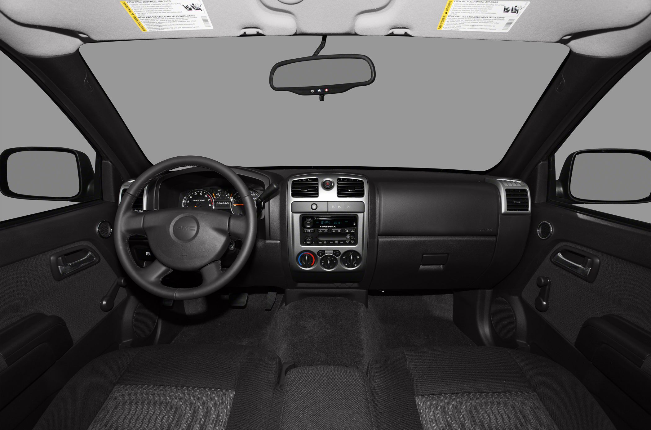 Dashboard, steering wheel, and central control panel with manual controls