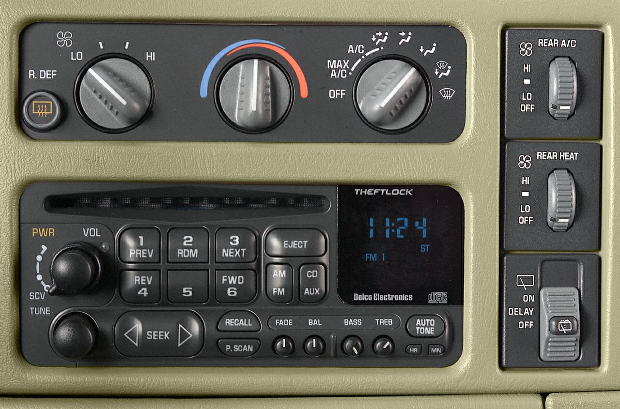 Climate control dials and Delco Electronics radio panel with cassette and CD player