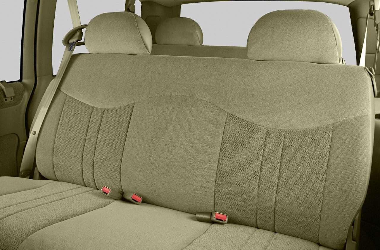 Beige fabric rear bench seat with headrests and seatbelts