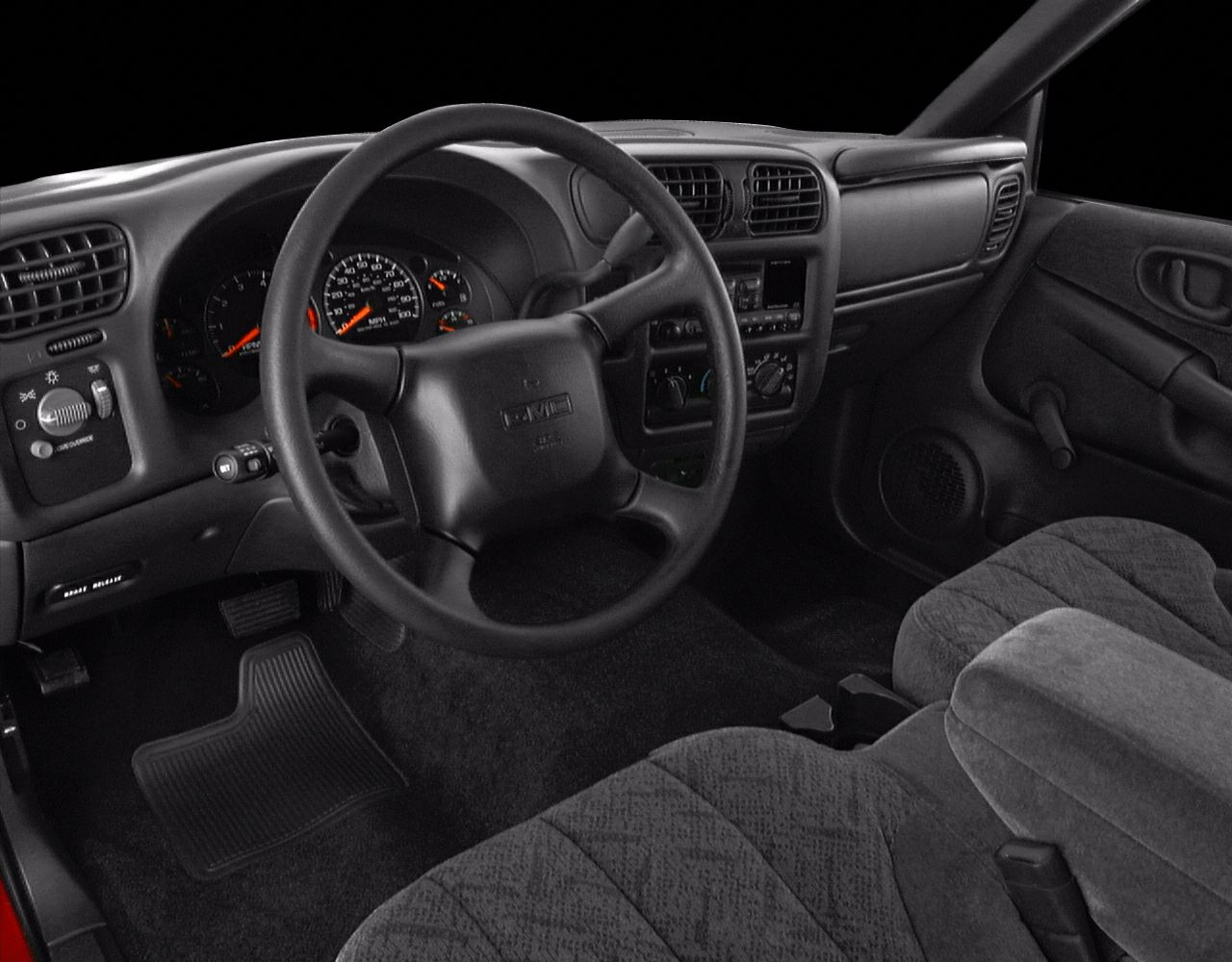 Dashboard, steering wheel, and fabric seats interior