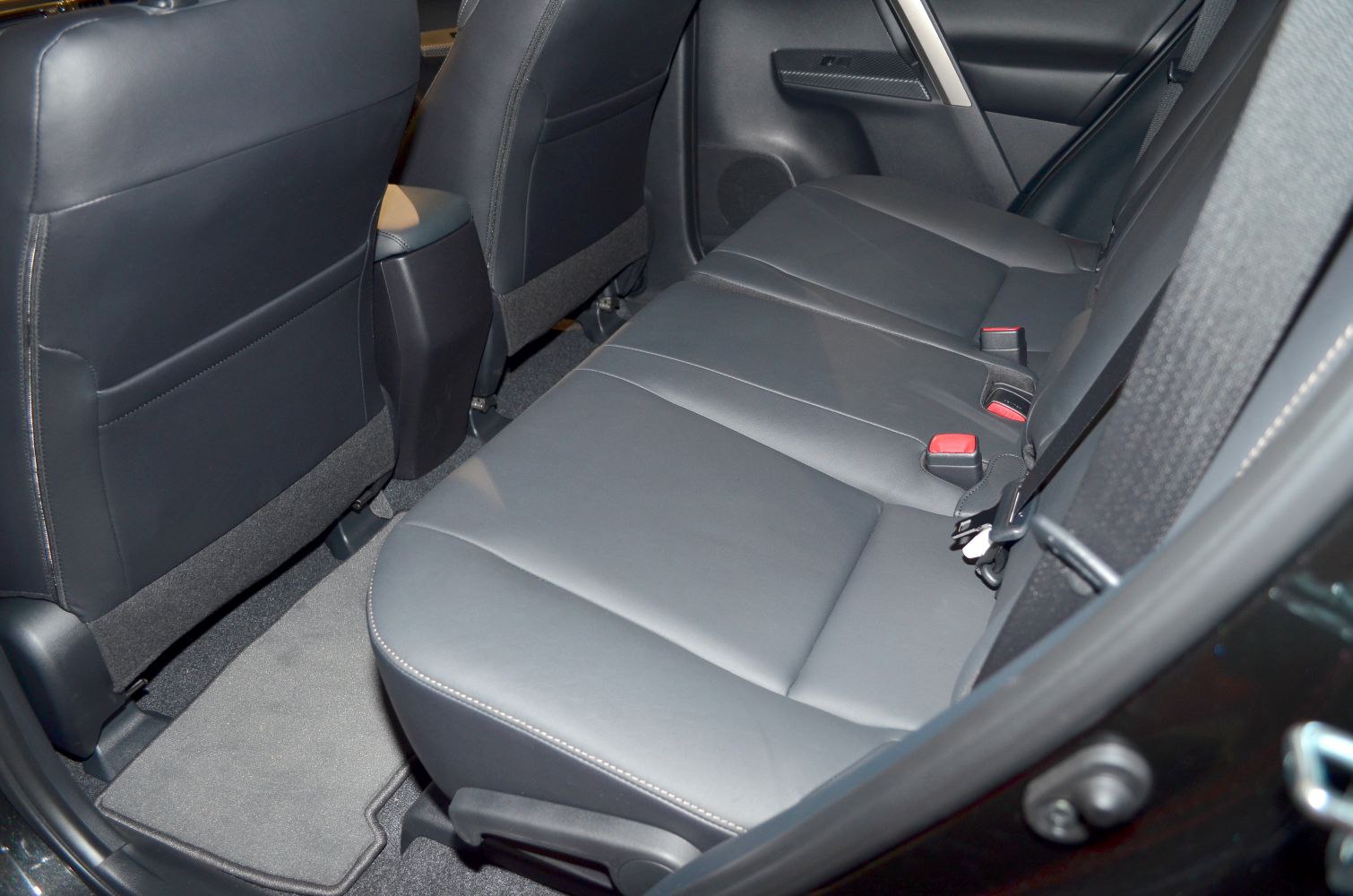 Black leather rear seats with spacious legroom and seatbelts