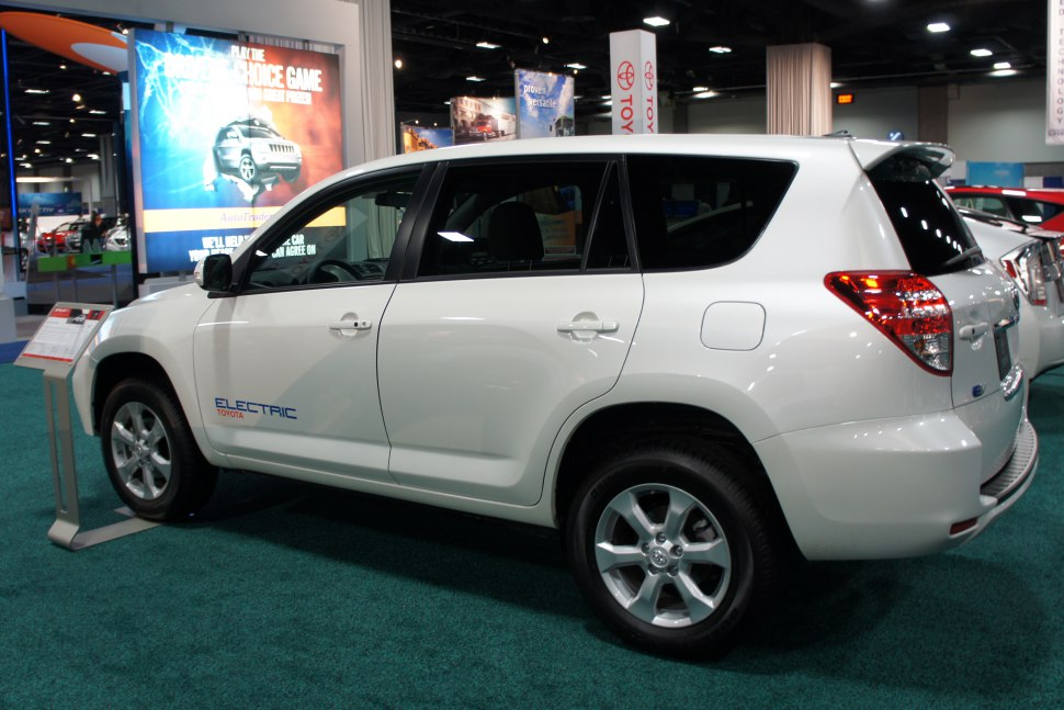 Side view of a white electric SUV with 'Electric' badge