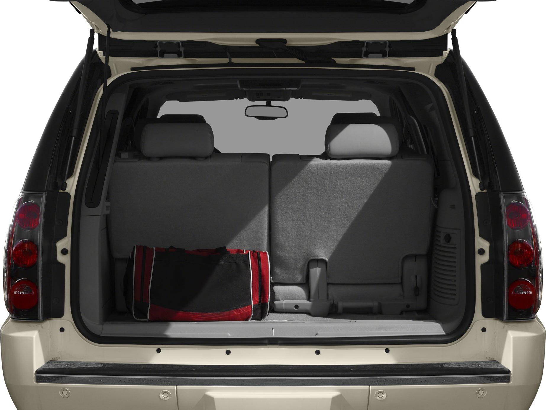 Folded rear seats and cargo space view in SUV rear interior