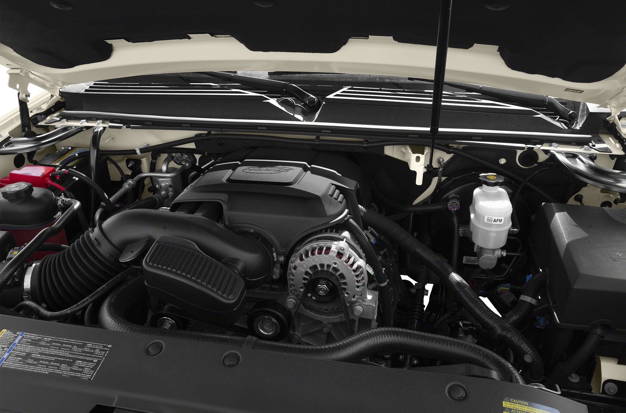 Engine bay with intake system and alternator under hood