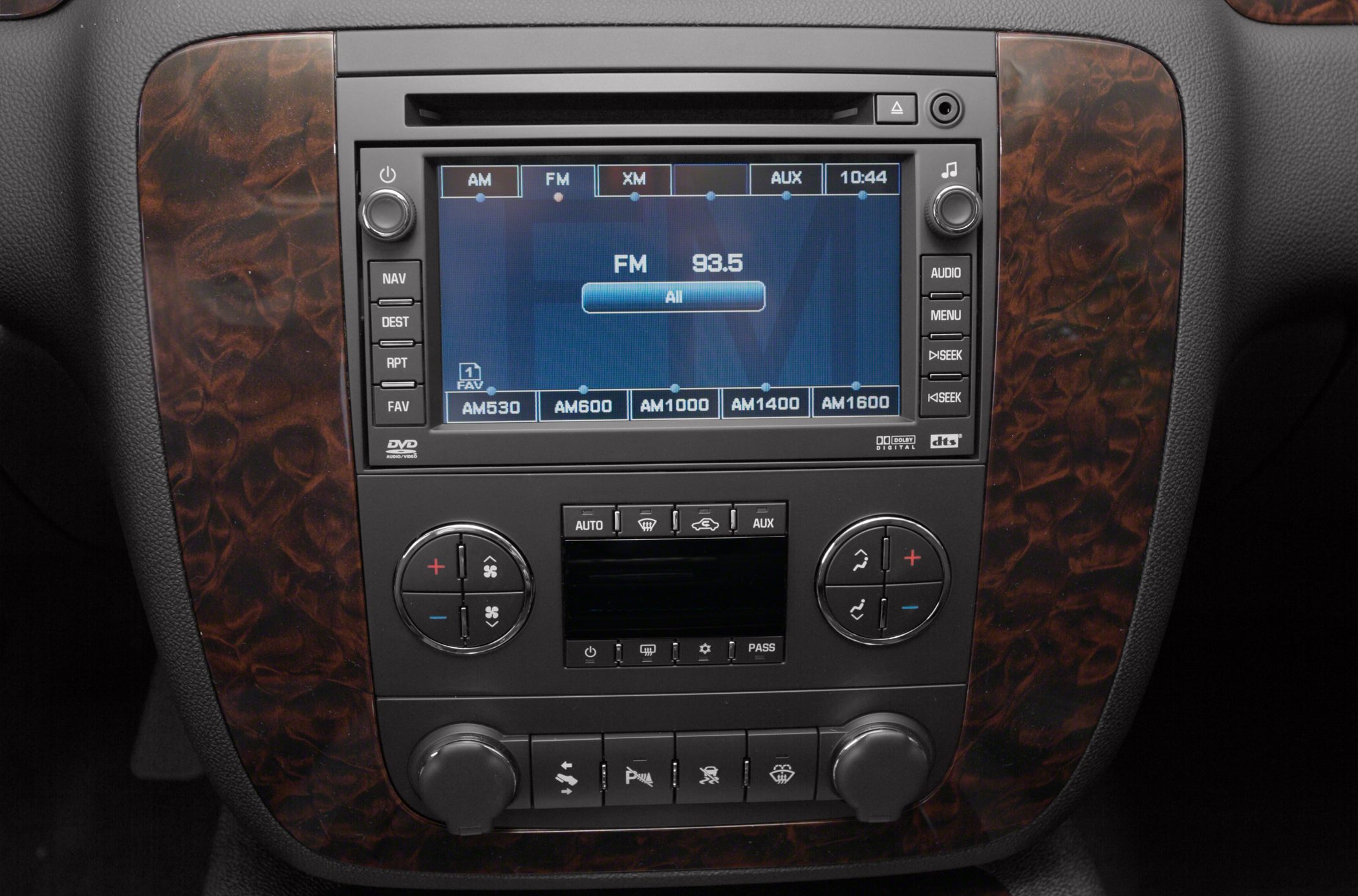 Touchscreen radio and dual-zone climate control on wooden trim dashboard