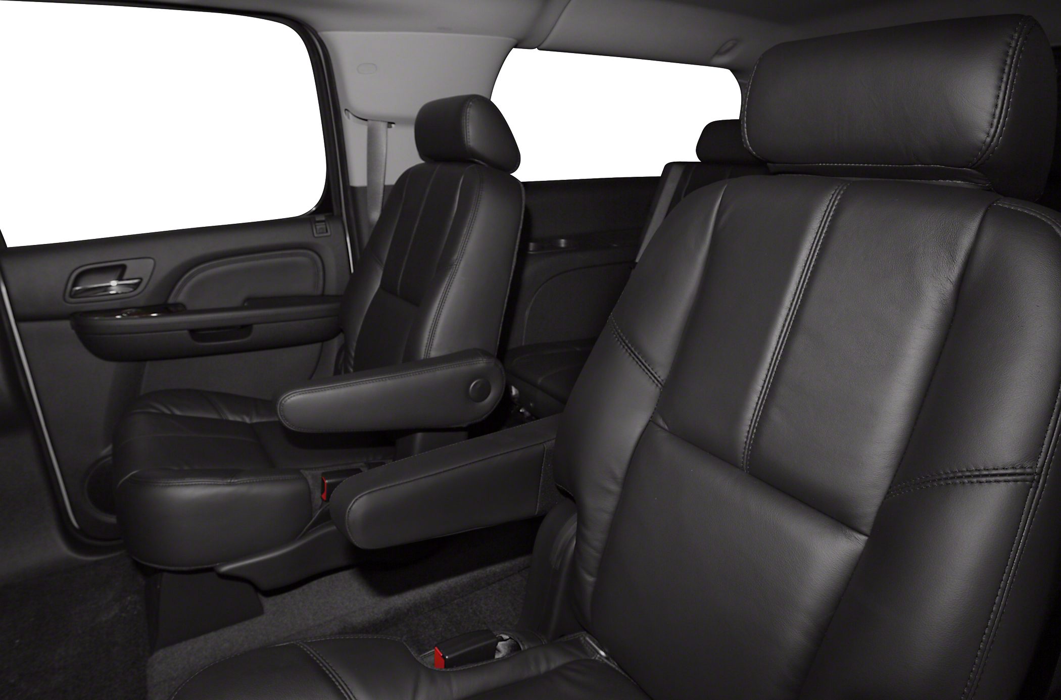 Black leather second-row seats with armrests and spacious interior