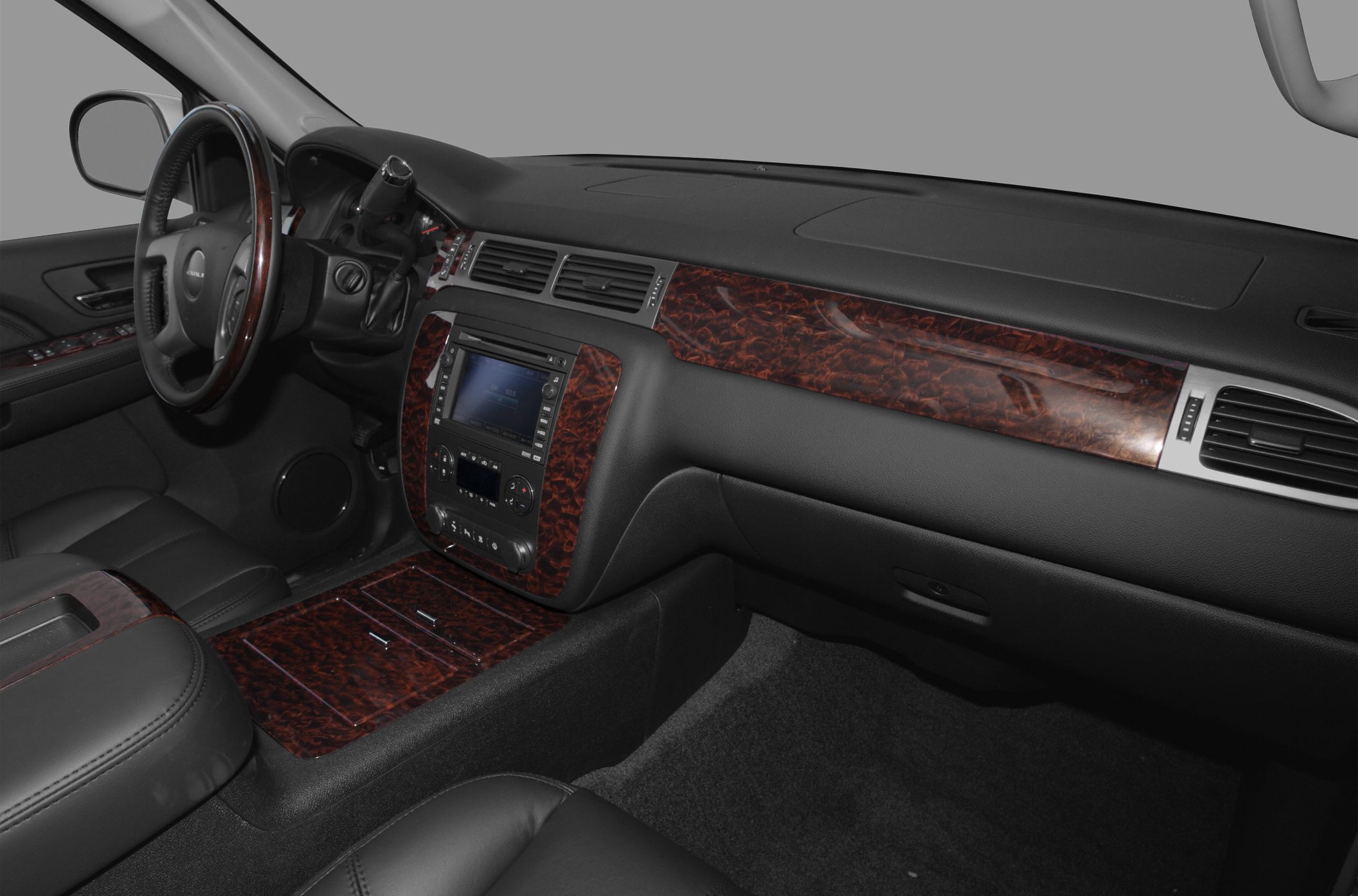 Interior with wood trim dashboard and leather steering wheel with controls