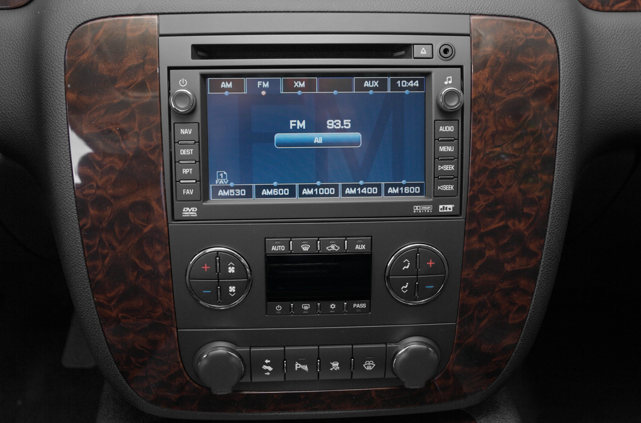 Infotainment and climate control panel with wood trim