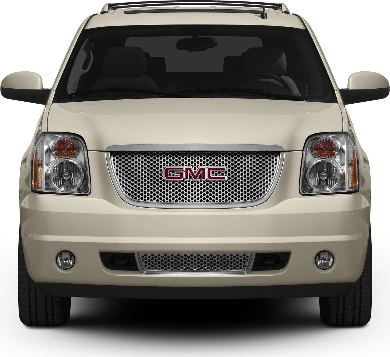 Front view with mesh grille, dual headlights, fog lights, and beige body