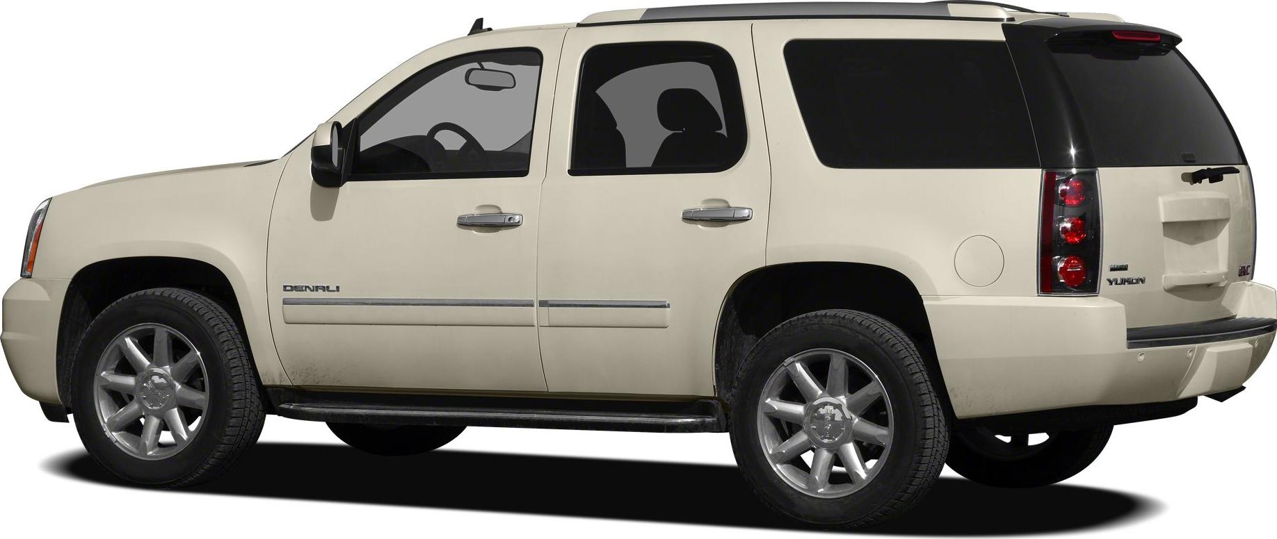 Side view of beige full-size SUV with Denali trim and distinct wheels