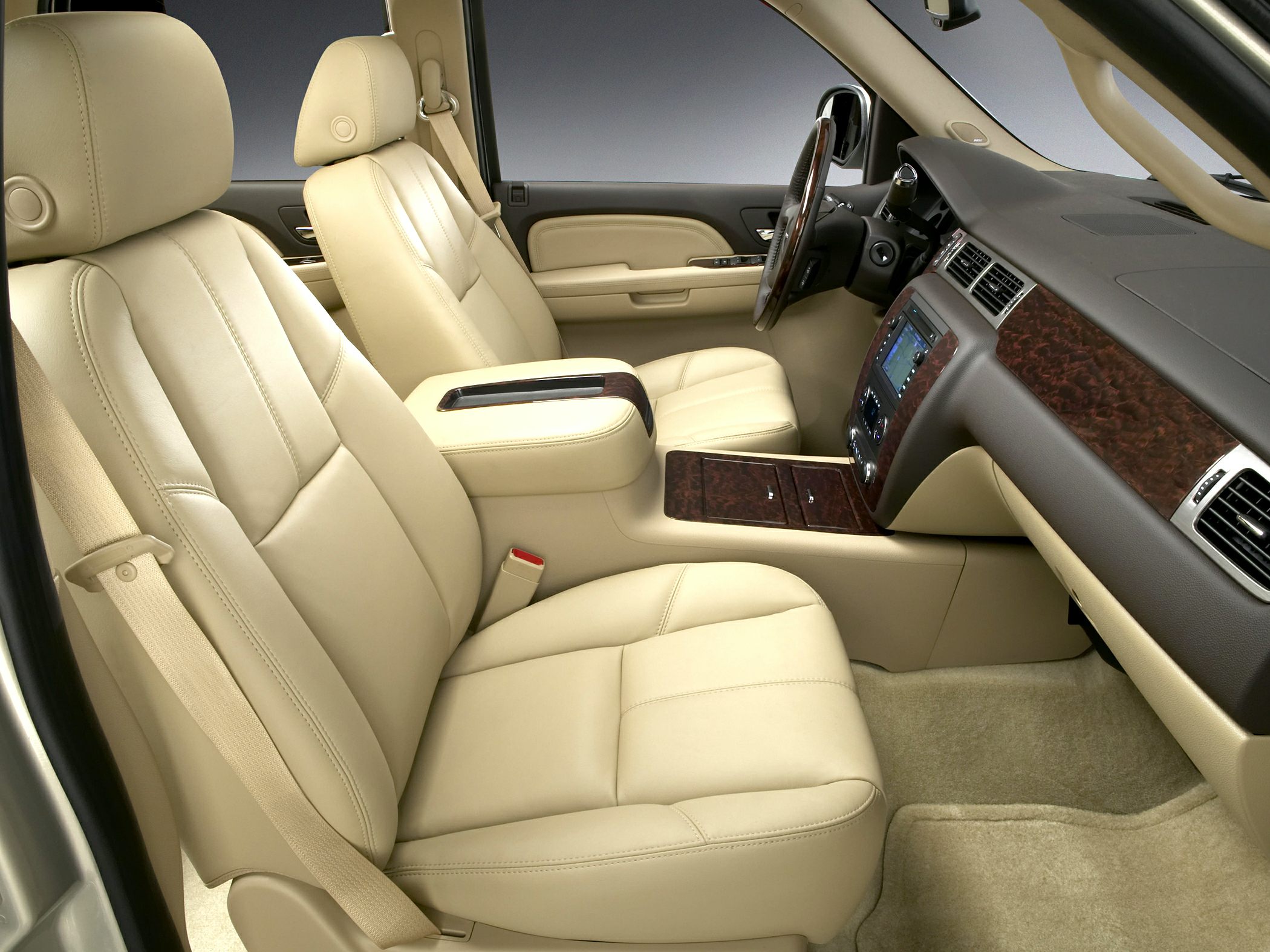 Beige leather seats with wood trim dashboard and center console
