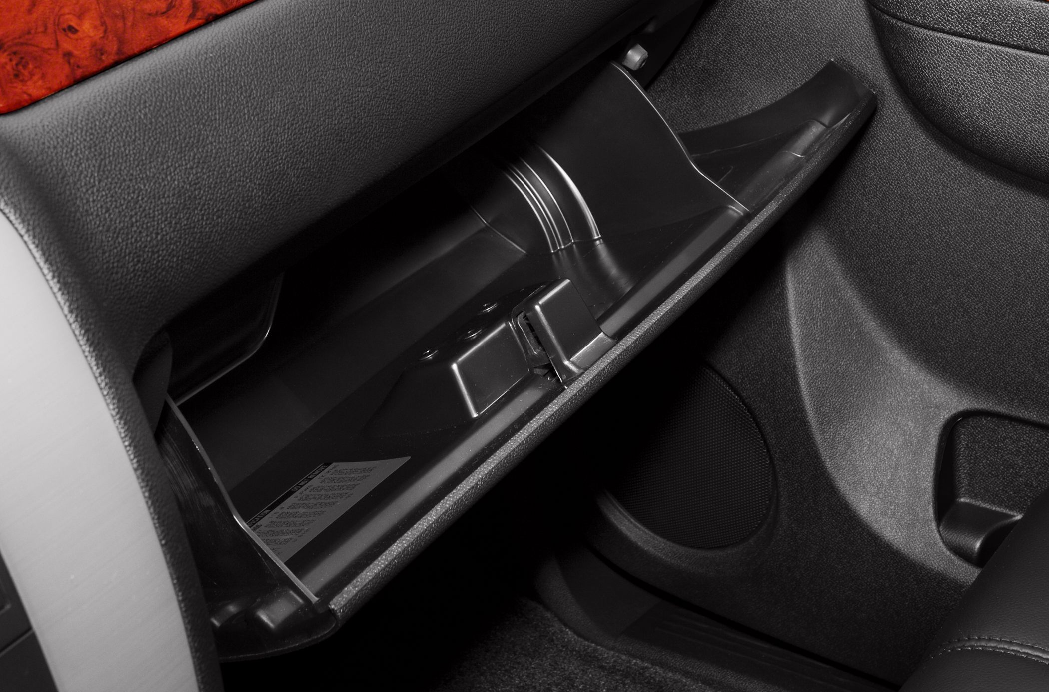 Open glove box and surrounding dashboard interior trim