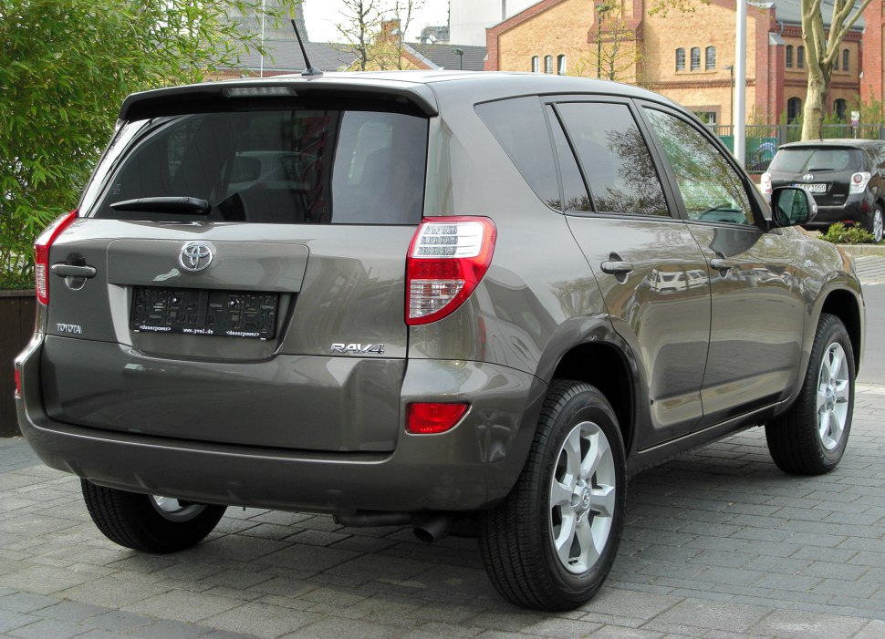 Rear side view of mid-2010s compact SUV with distinctive taillights and alloy wheels.