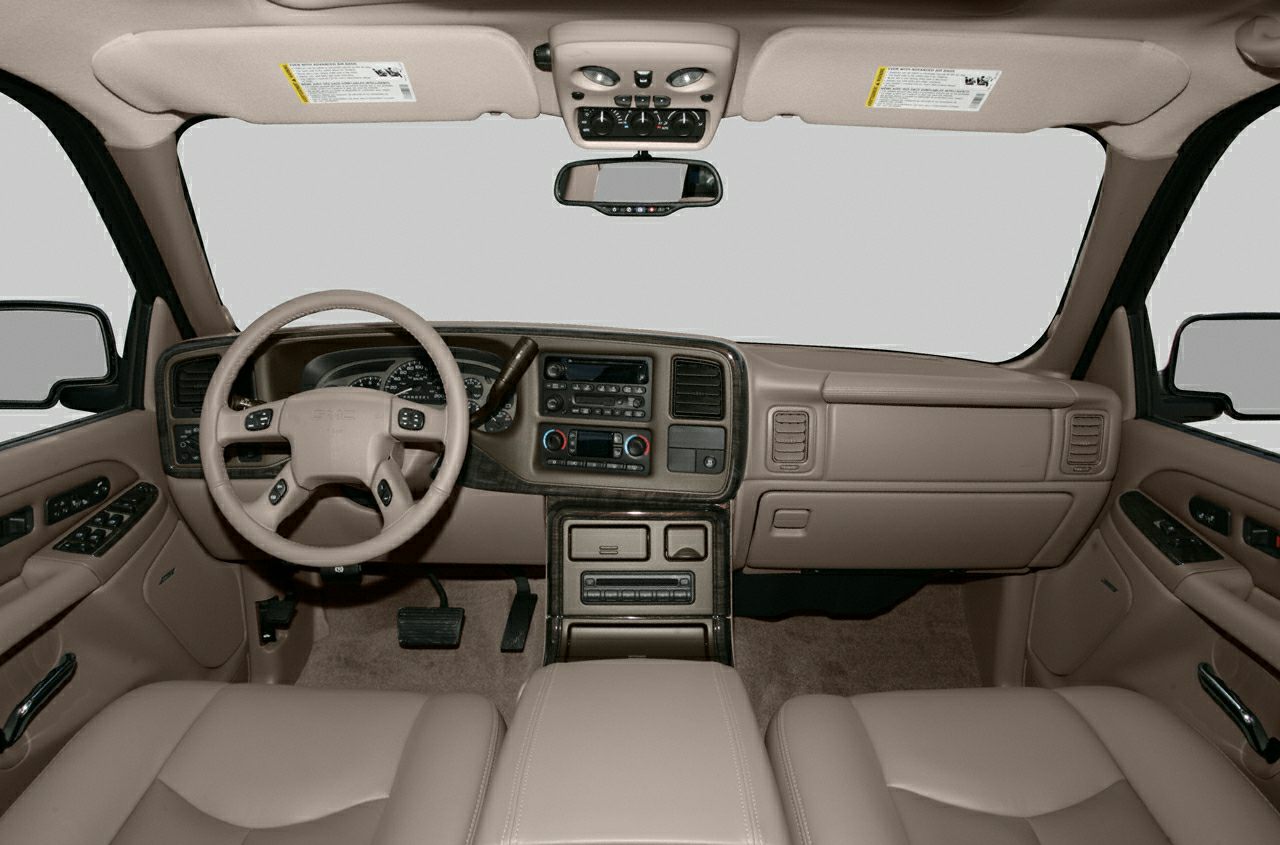 Dashboard and steering wheel with beige interior upholstery