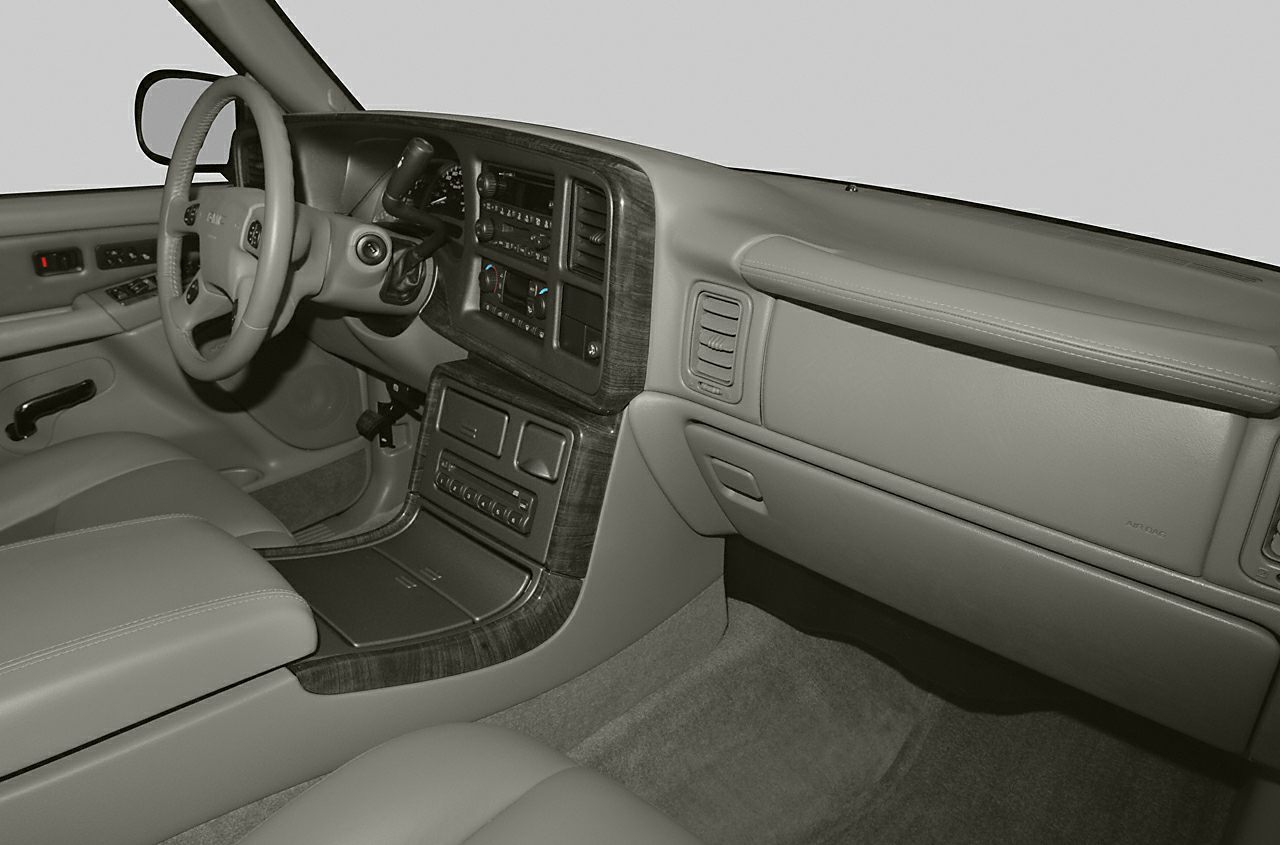 Dashboard and front cabin interior with wood trim and control panels