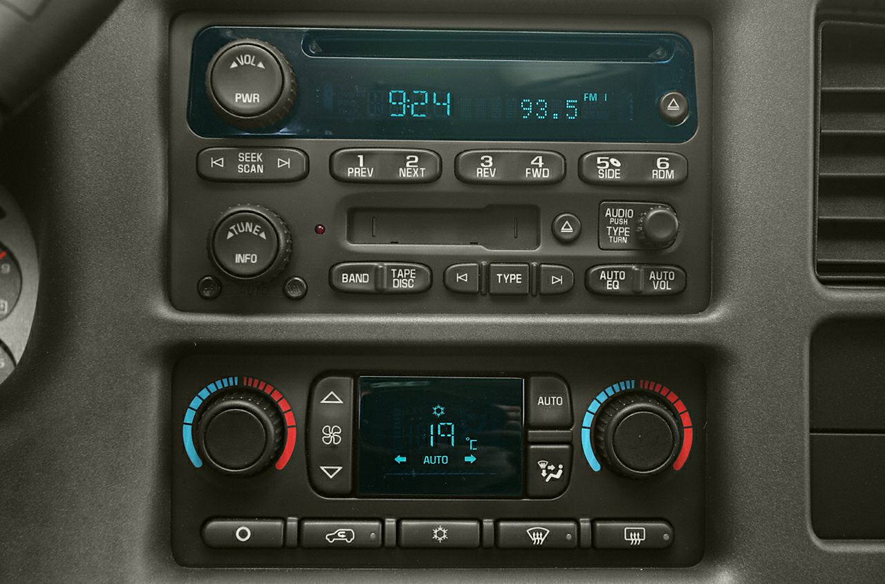 Radio and digital climate control panel with knobs and buttons