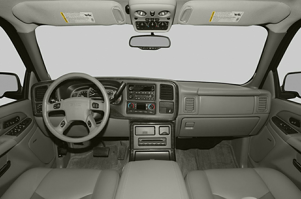 Dashboard and steering wheel with overhead console and door controls