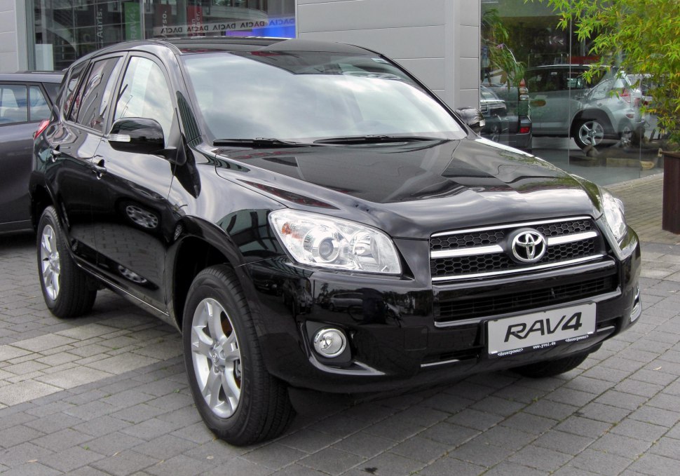 Front and side view of black SUV with prominent grille and headlights