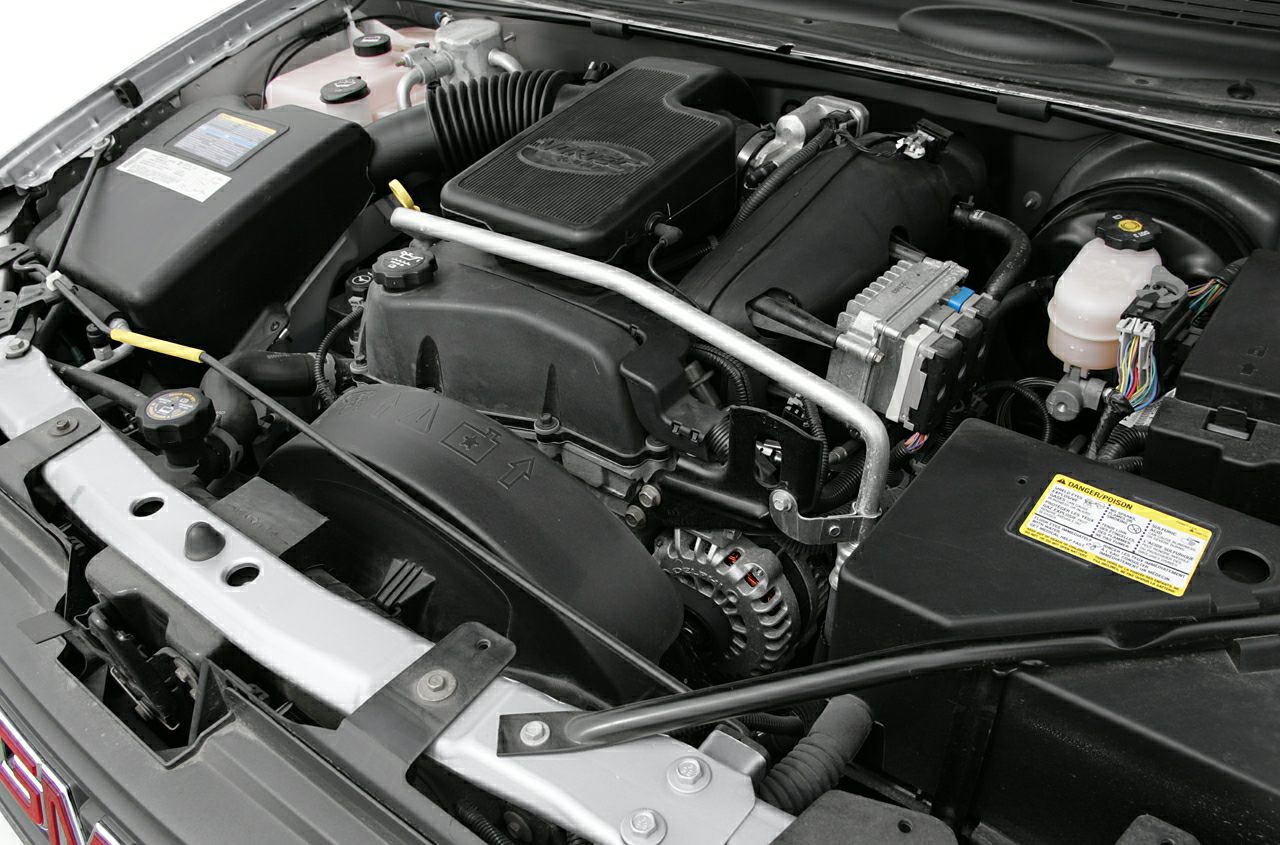 Close-up view of a detailed SUV engine bay with visible components.