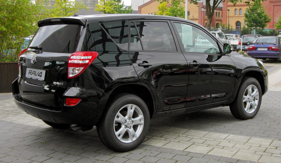Rear side view of a black compact SUV with alloy wheels and tinted windows