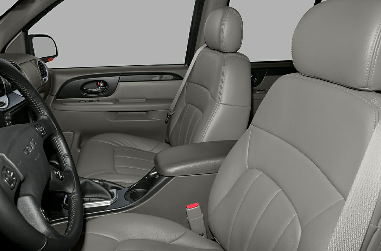 Grey leather front seats and center console with door panel details