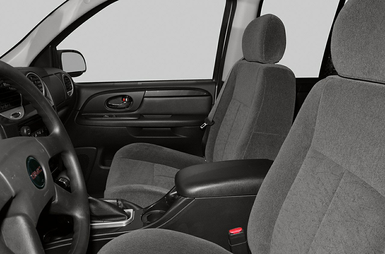 Front cloth seats, steering wheel, and door panel of a mid-size SUV interior