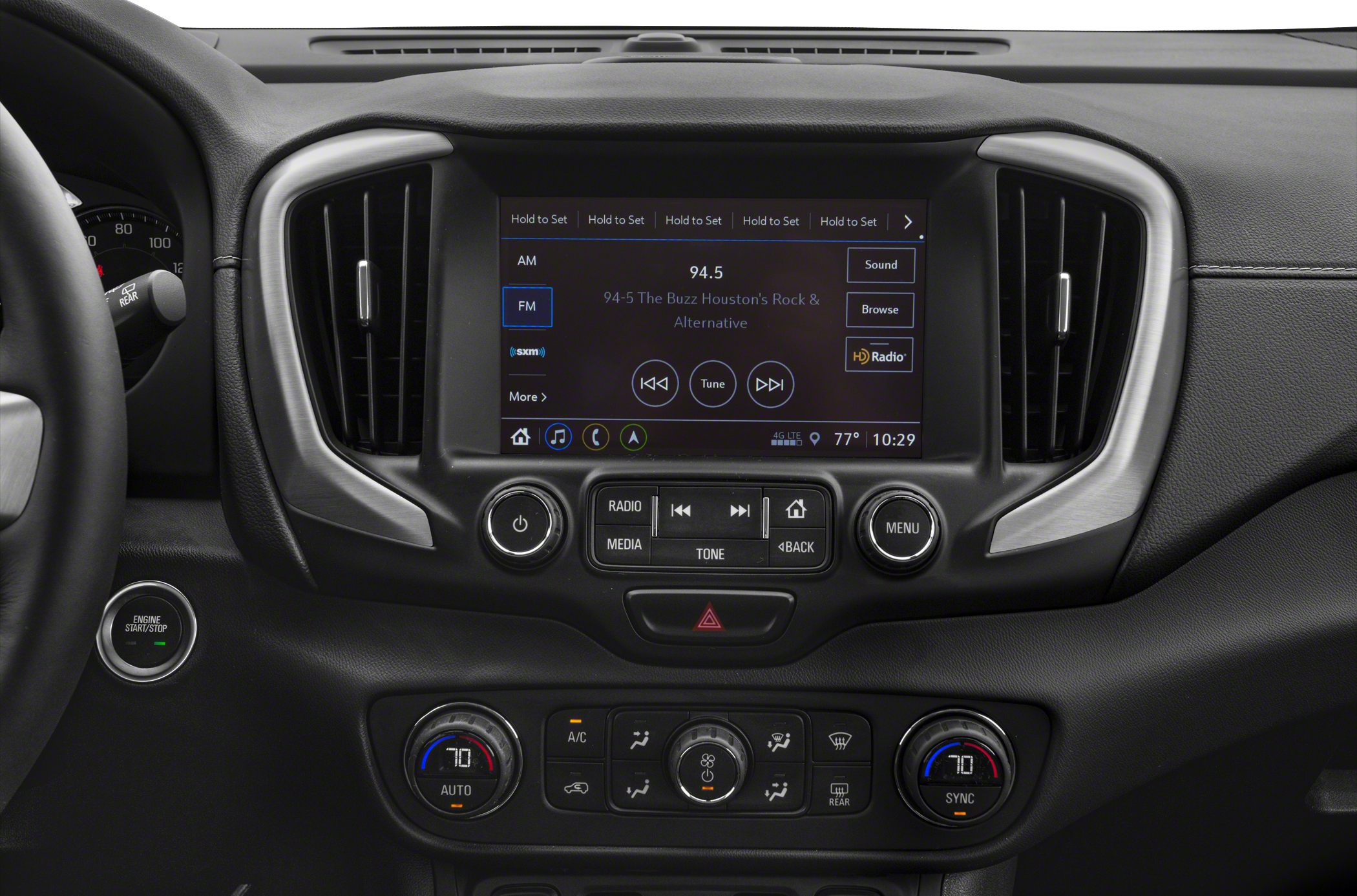 Dashboard center console with infotainment screen, climate controls, and push start button