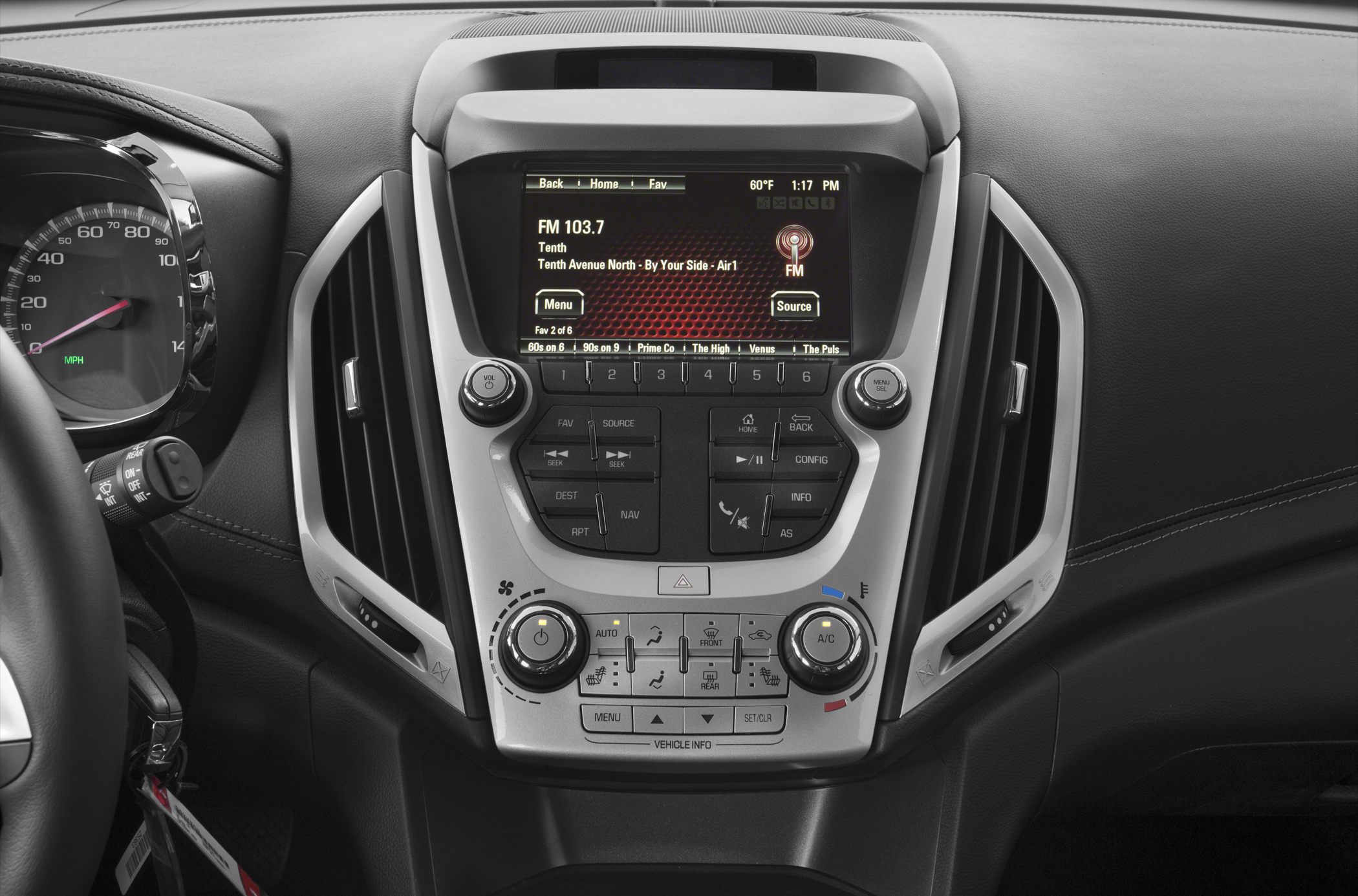 Center console with infotainment touchscreen and climate control knobs