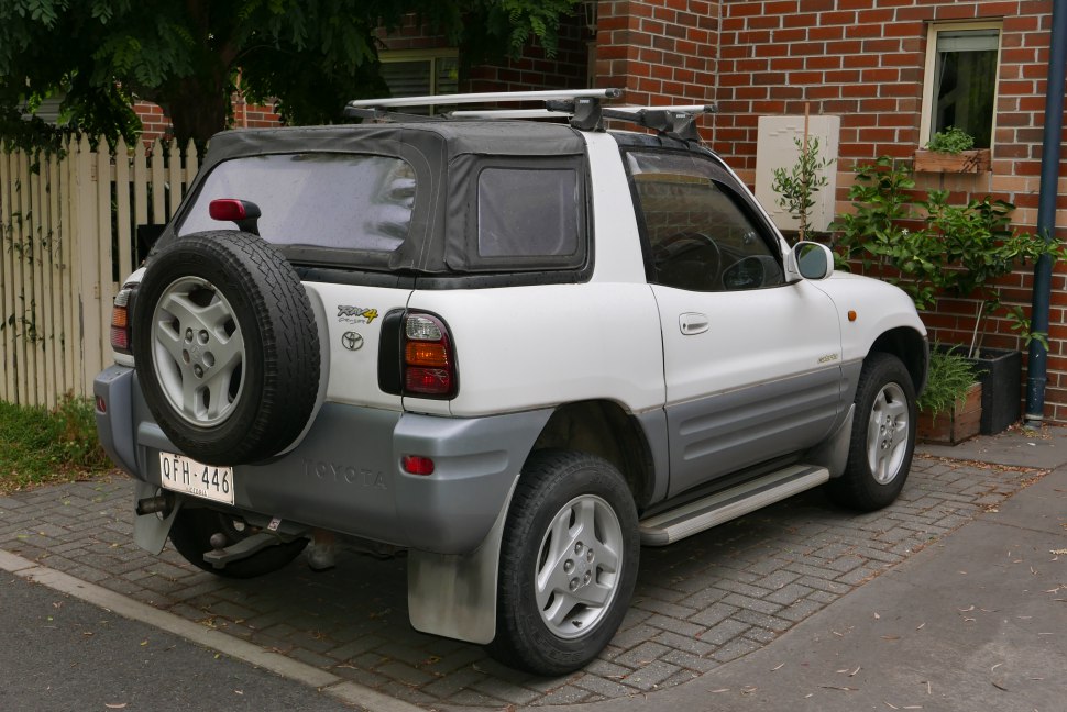 Soft top convertible roof with rear-mounted spare tire and tailgate