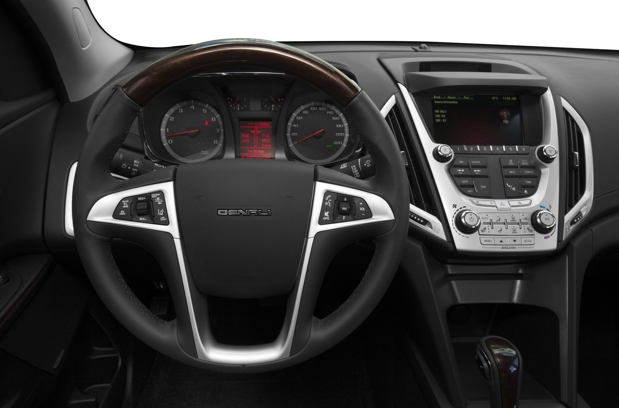 Steering wheel with control buttons and digital dashboard display.