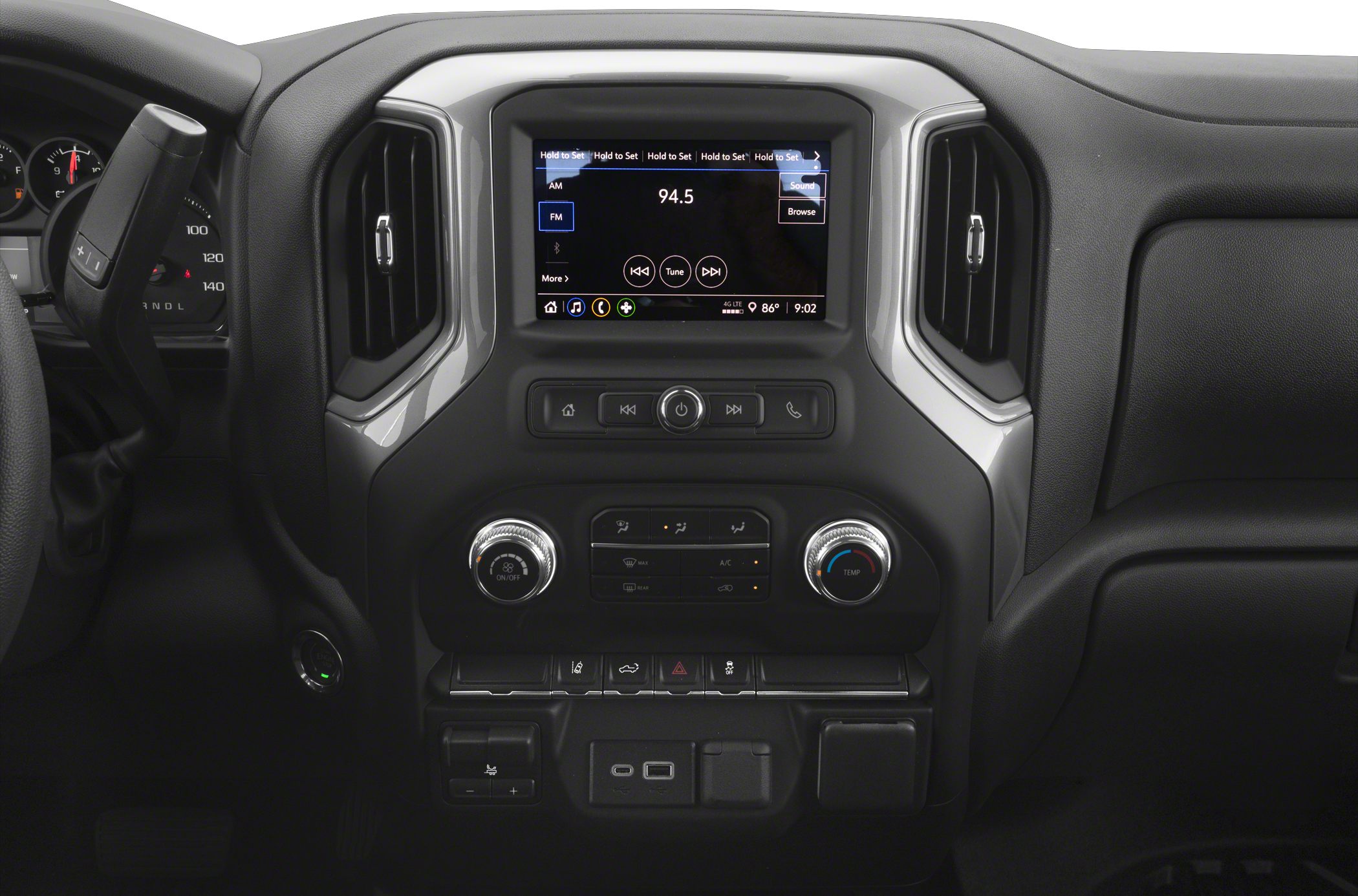 Infotainment and climate control center with connectivity ports and dashboard controls