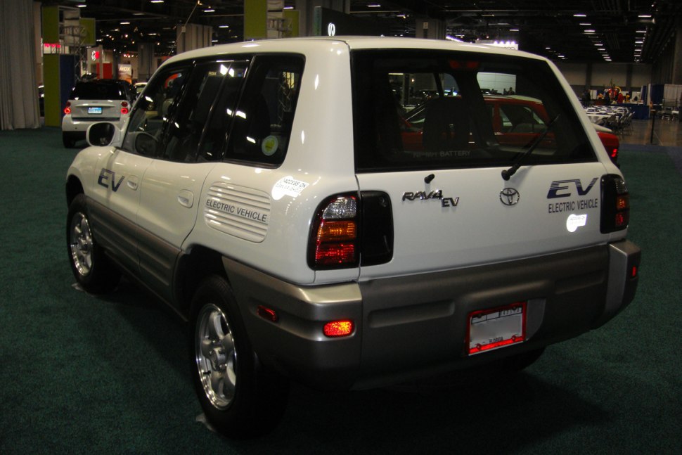 Rear view of a 5-door electric SUV with EV badges and tail light cluster.
