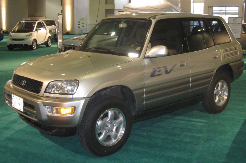 Electric SUV front side profile with EV decal and alloy wheels