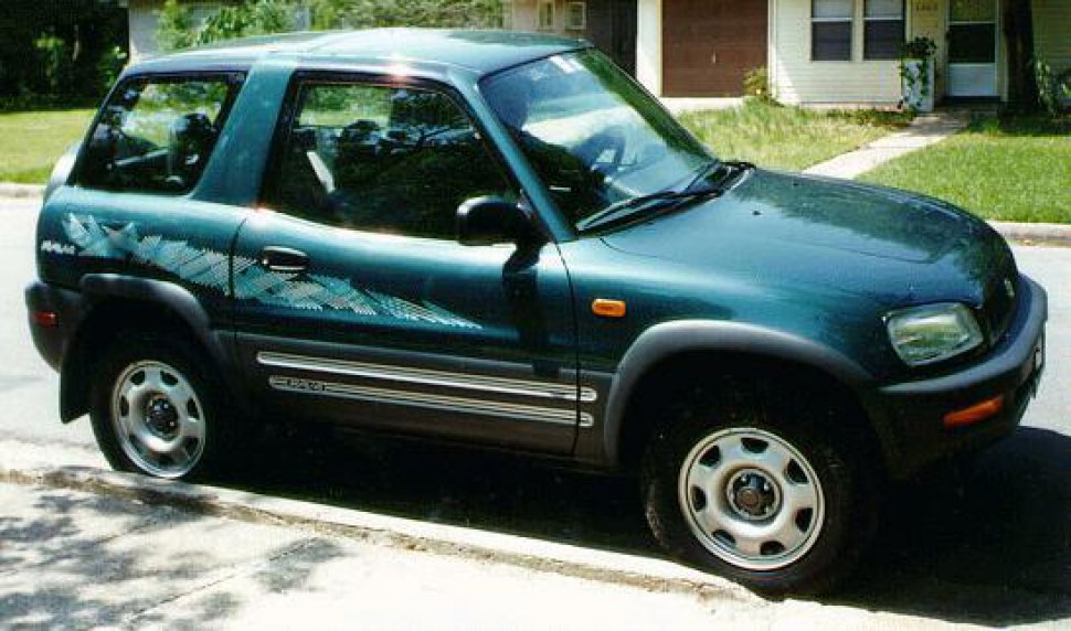 Side profile of compact SUV with 3 doors and body decals