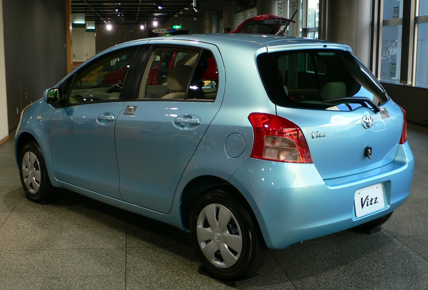 Compact 5-door hatchback showing side and rear with rounded taillights