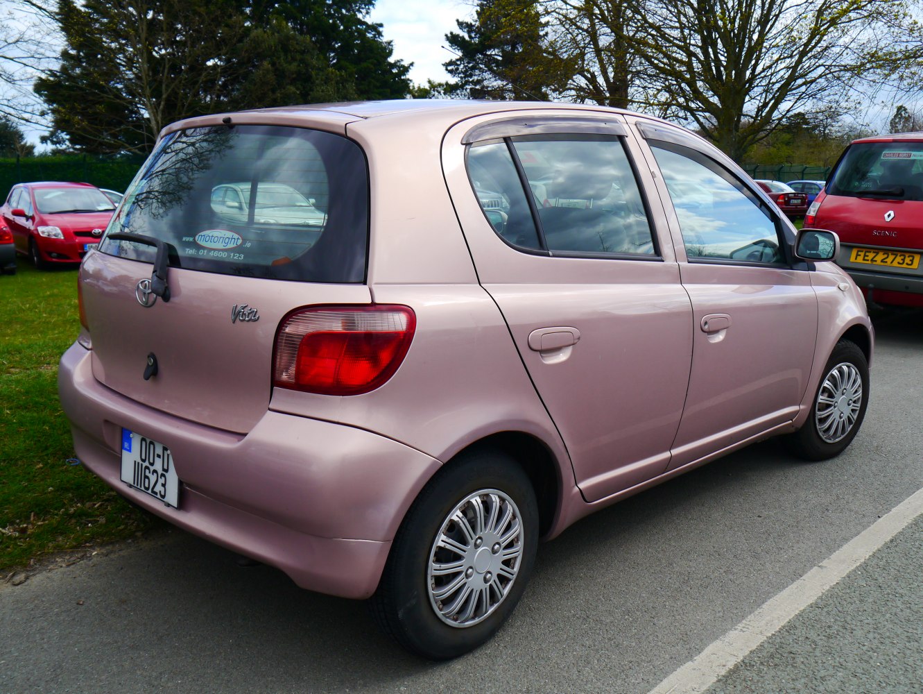 Compact hatchback rear-side with rounded tail lights and five doors