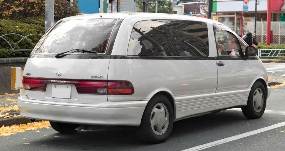 Rear-side profile of a classic minivan with a distinct rear light cluster.