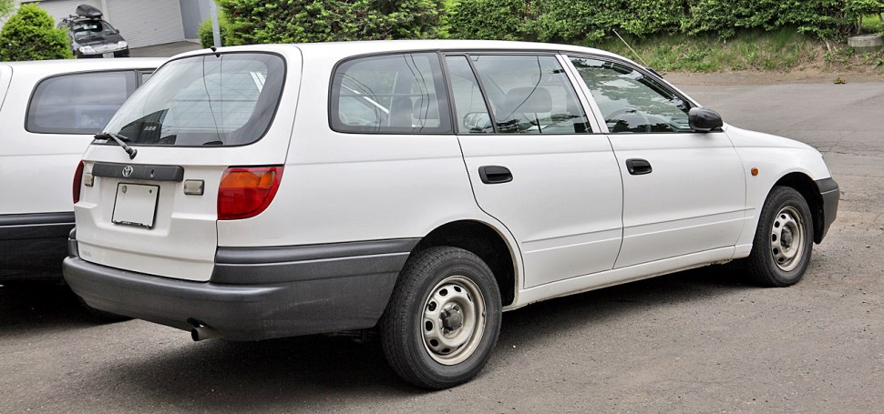 Rear and side view of a white station wagon