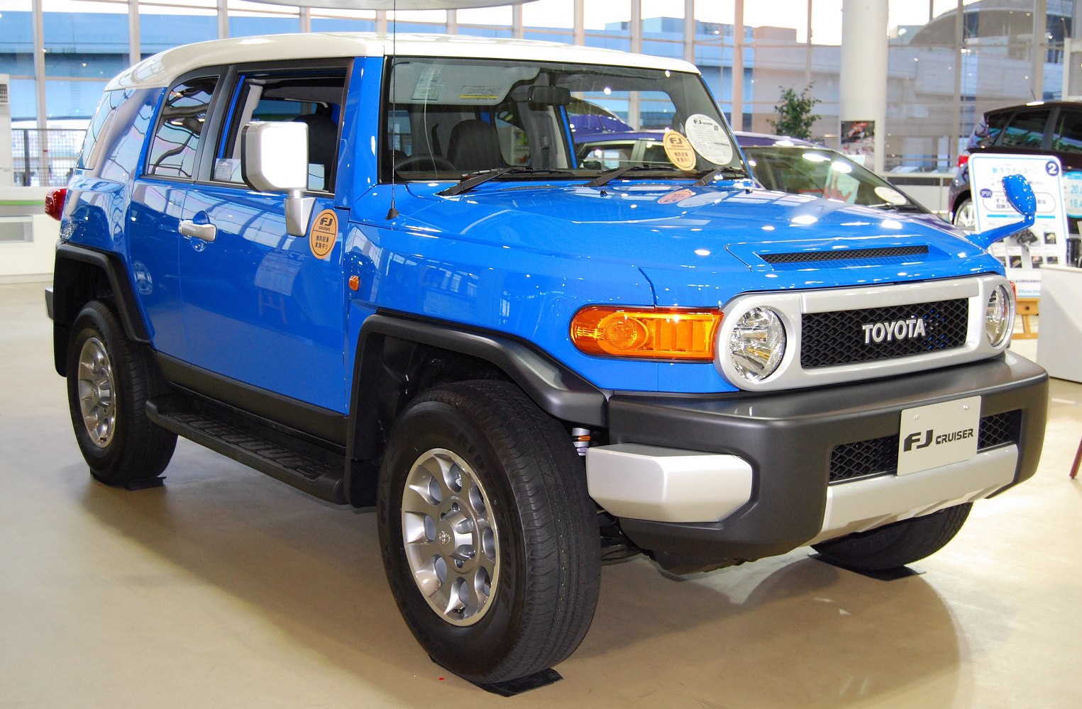 Blue SUV with round headlights and rugged design