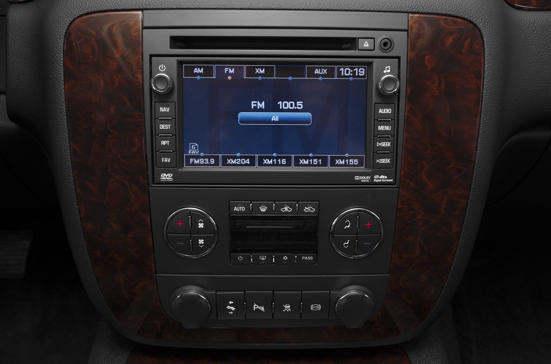 Vehicle infotainment system and climate control panel with wood trim
