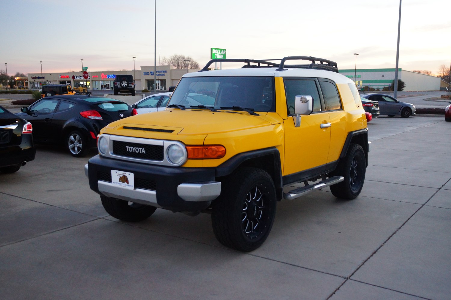 Yellow off-road SUV with roof rack and large tires