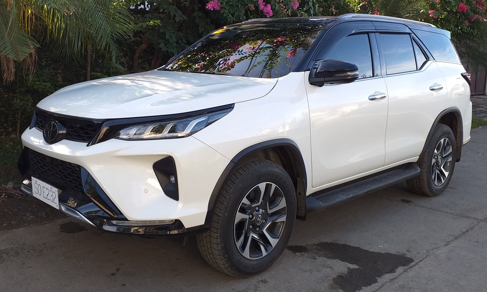 Front side view of a modern SUV with sleek lines and alloy wheels