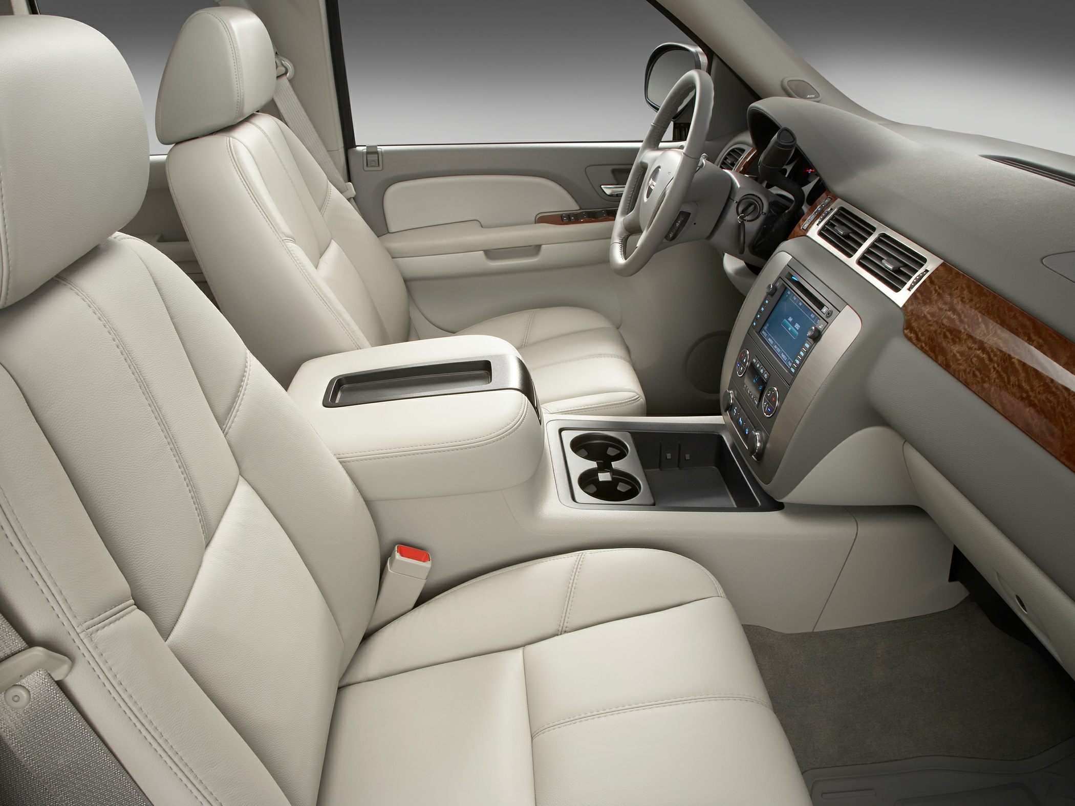Beige leather seats and modern dashboard with wood trim