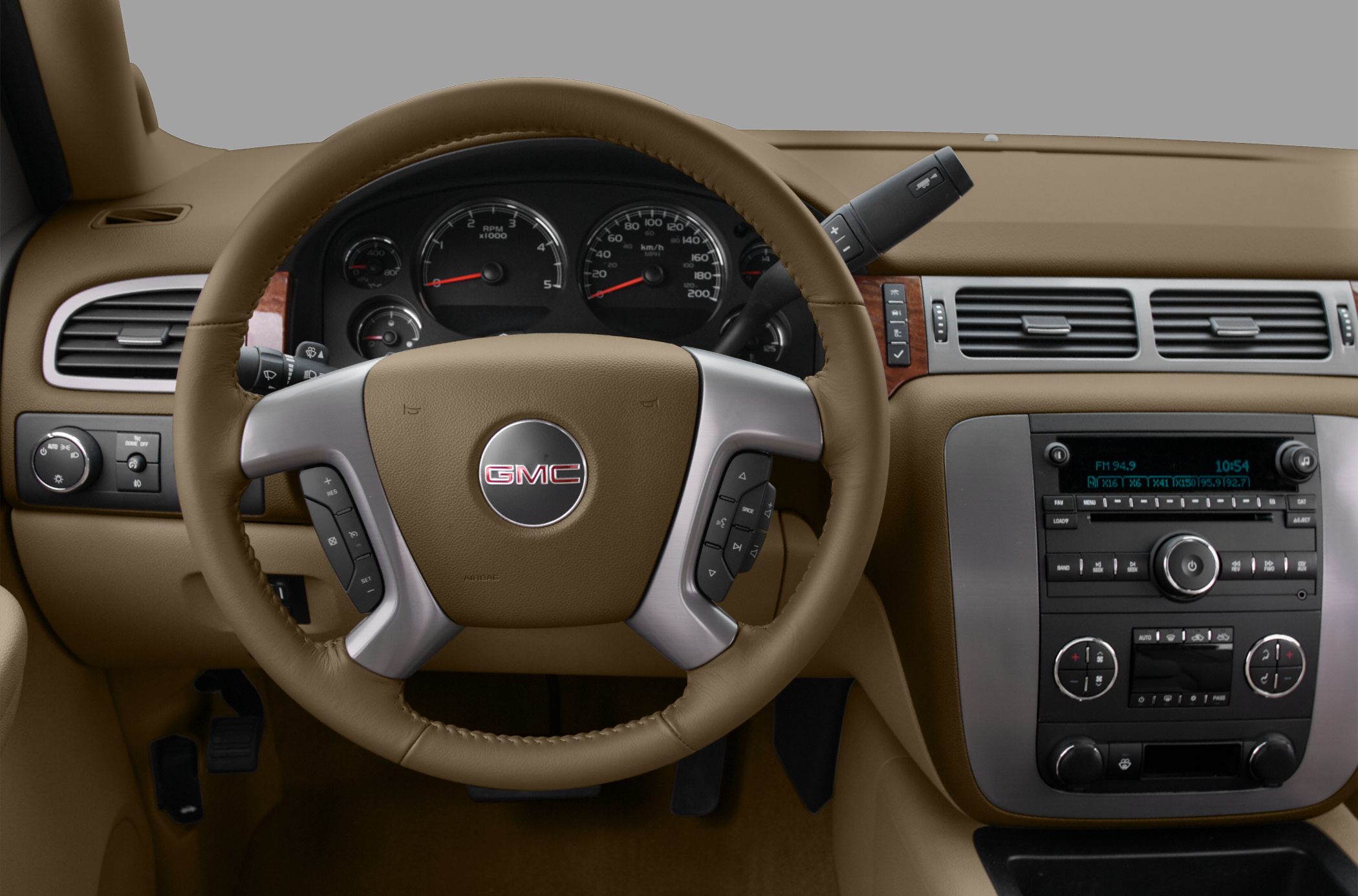 Leather-wrapped steering wheel and dashboard with integrated controls