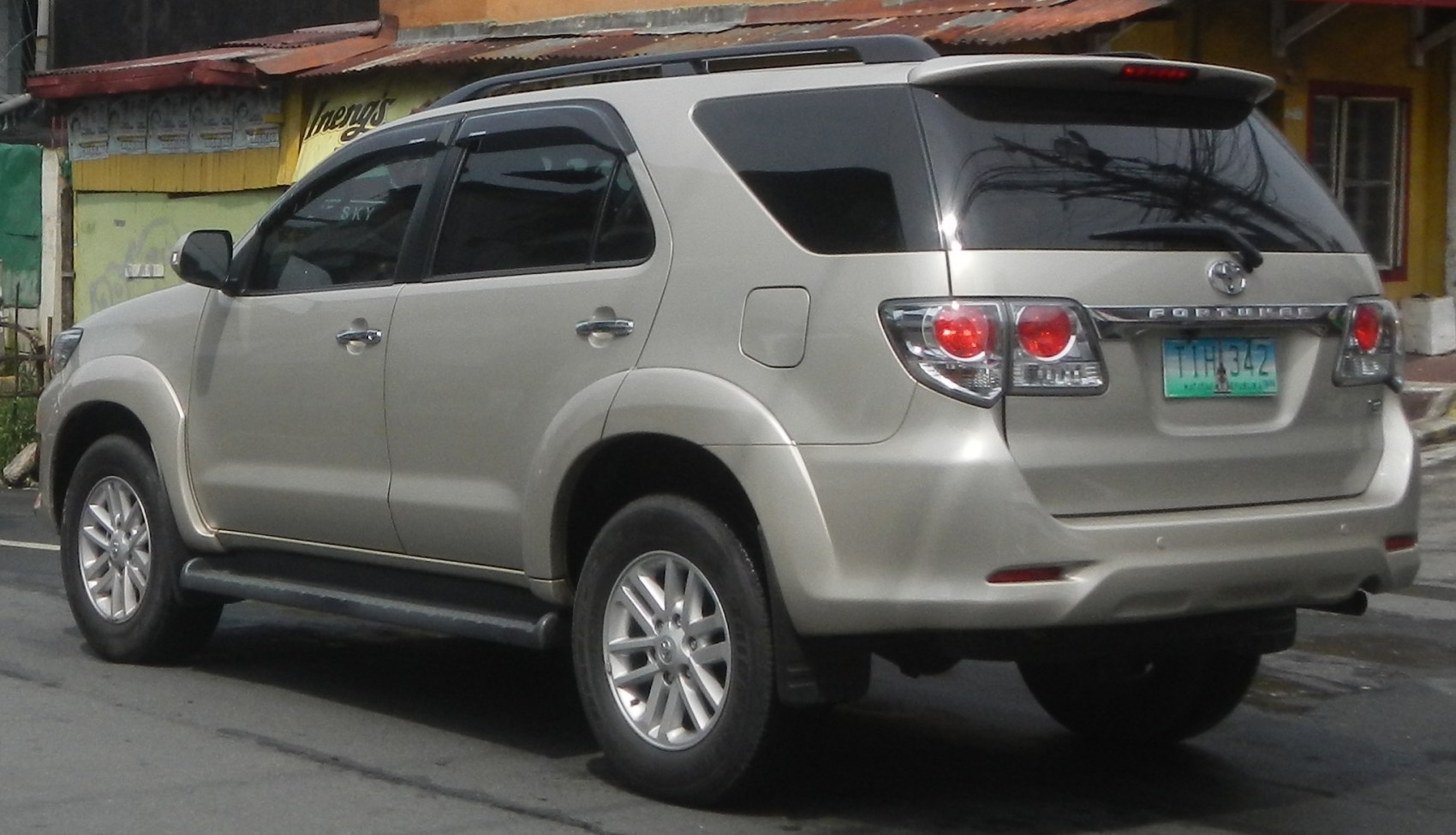 Rear side view of SUV with distinctive tail lights and alloy wheels