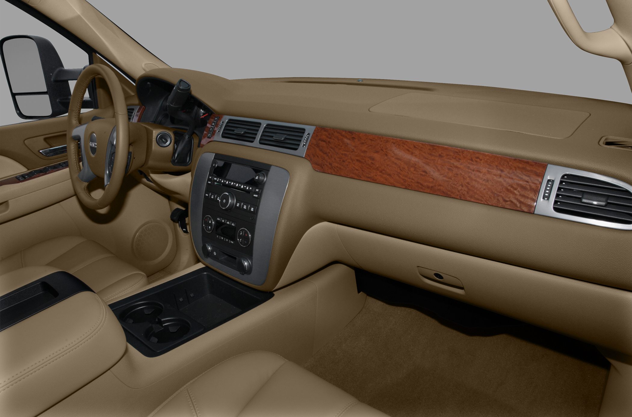 Beige interior with wood dashboard trim and central control panel